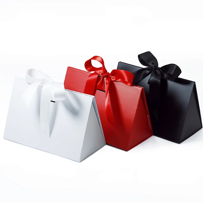 Luxury white, red, and black triangle folding boxes secured with elegant silk ribbons.